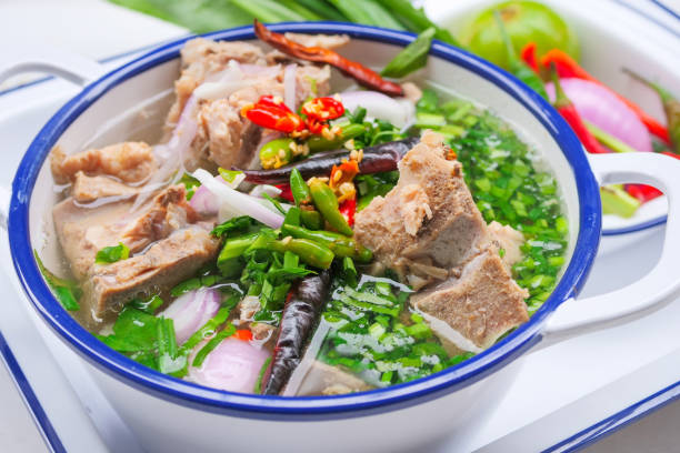 istock Spicy pork bone soup in Thai style Is a clear pork bone soup with large pork bones, decorated with chili and Thai herbs 1166797021