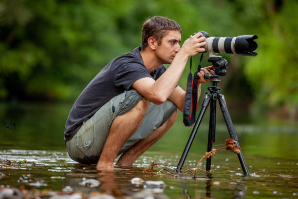 istock Wildlife photographer passionately working on a location with patience 1166798286