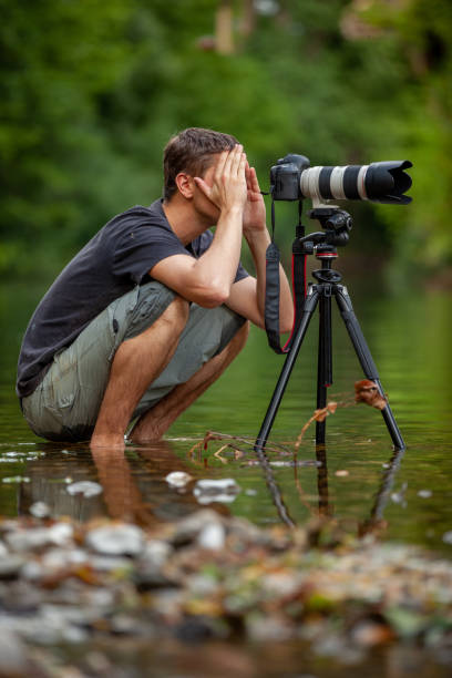 istock Wildlife photographer passionately working on a location with patience 1166798342