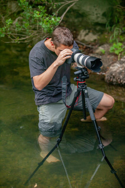 istock Wildlife photographer taking every necessary step to capture a great image 1166798701
