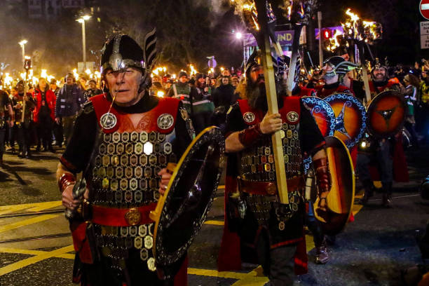 Hogmanay Torchlight Procession, Edinburgh, Scotland, taken on 31 December 2016 Hogmanay torchlight procession through streets to celebrate New Year's Eve in Edinburgh hogmanay photos stock pictures, royalty-free photos & images
