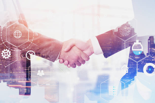 istock Handshake of men in city, digital interface 1166802379