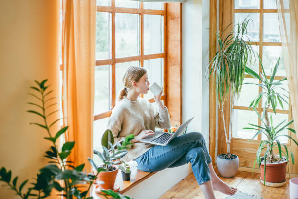 istock Young woman drinking her morning coffee. 1166802672