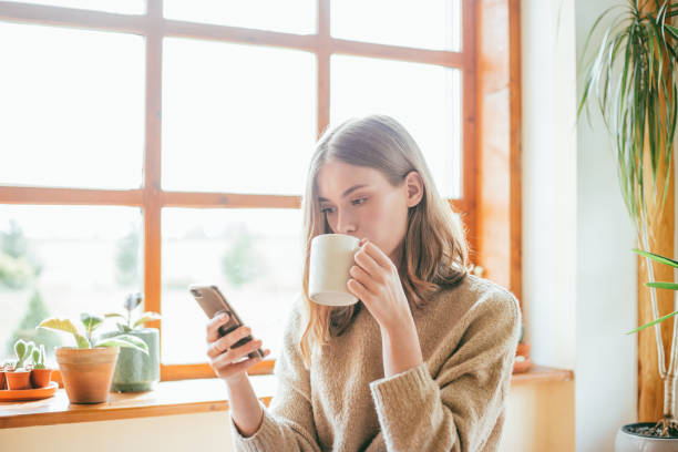 istock Young woman drinking coffee. 1166803306