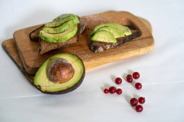 istock avocado sandwich on a white background on an chopped wooden board 1166803738