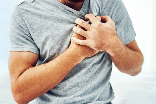 Knowing the signs can save your life Cropped shot of an unrecognizable man suffering from chest pain heart disease photos stock pictures, royalty-free photos & images
