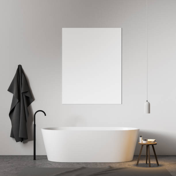 istock White bathroom interior with tub and poster 1166803863