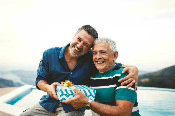 istock Son giving a gift for his father on father's day. 1166804696
