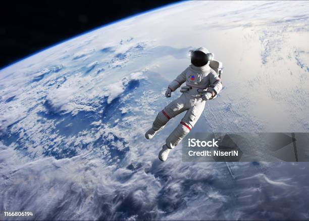 Astronaut Conducting Spacewalk On Earth Orbit Stock Photo - Download Image Now - Astronaut, Outer Space, Spacewalk
