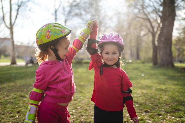 istock Happy girls celebrate learning how to roller skate 1166806979