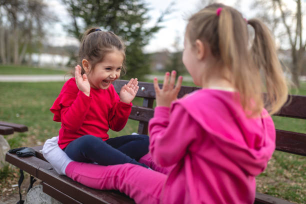 istock Joyful girls playing at the park 1166807024