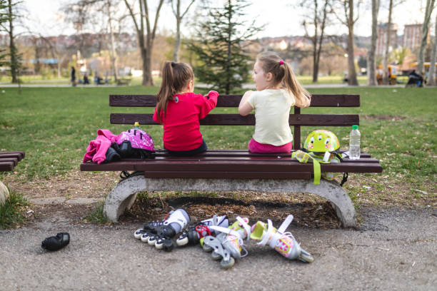 istock Little girls sitting and relaxing after training 1166807066