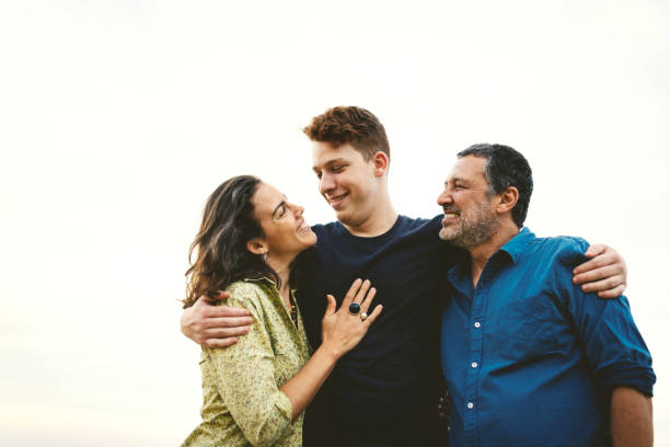 istock Family together outdoors smiling and having fun 1166807129