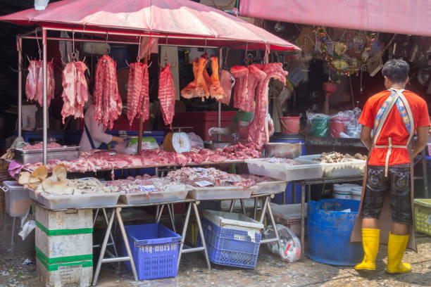 Bangkok, Thailand - 22nd April 2016: Fresh meat stall on Khlong Toei market. This Bangkoks largest wet market.