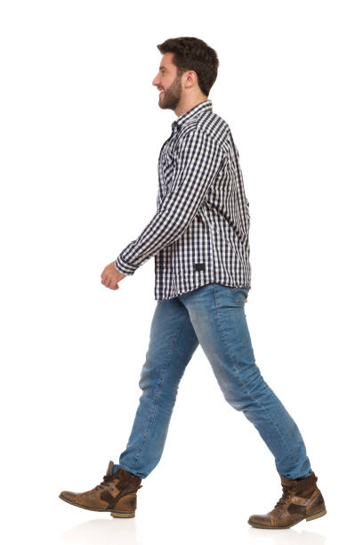istock Walking Smiling Man In Lumberjack Shirt, Jeans And Boots 1166810995