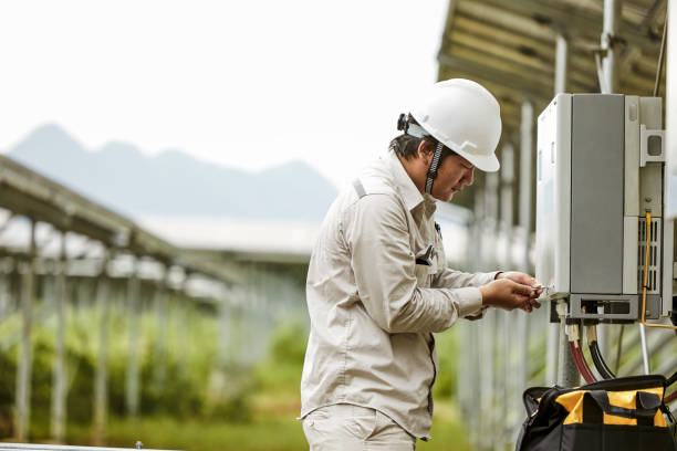 istock On a cloudy day, Asian engineers open the electric box for inspection. 1166811011