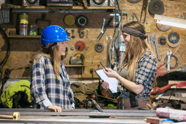 istock young women working in a mechanic shop 1166813376
