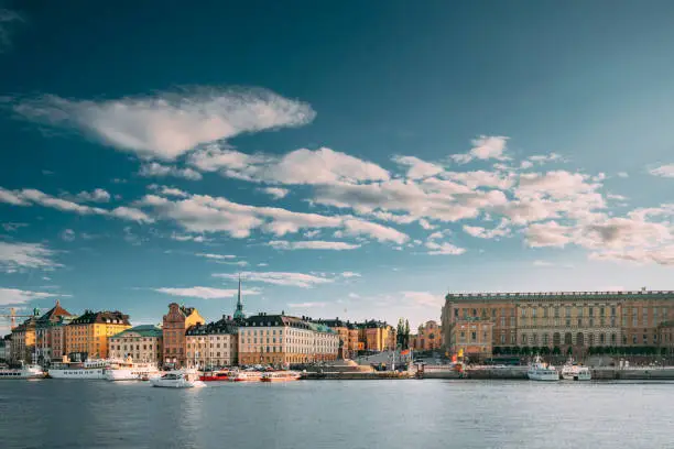 Photo of Stockholm, Sweden. Scenic Famous View Of Embankment In Old Town Of Stockholm At Summer. Gamla Stan In Summer Evening. Famous Popular Destination Scenic Place And UNESCO World Heritage Site