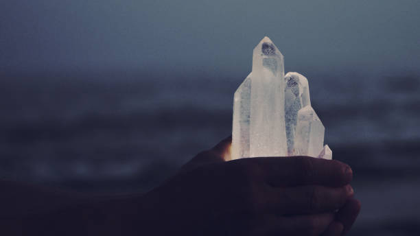 istock Beach relaxation. Holding healing crystals 1166819192