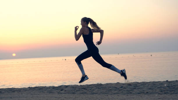 istock Jogging after sunset. Beach holiday 1166820648