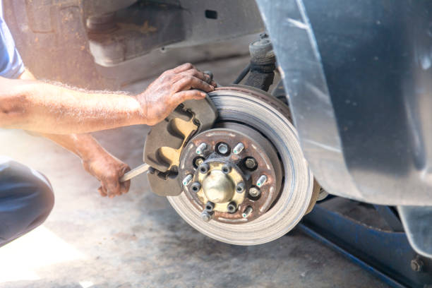 istock Transportation concept. Hand mechanic repair brake disc . 1166821311