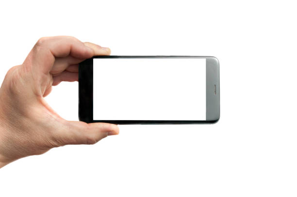 istock Man holding a blank screen smartphone horizontally on white background 1166824829