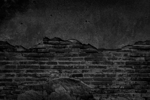 istock Black brick wall and concrete texture for background. 1166826147