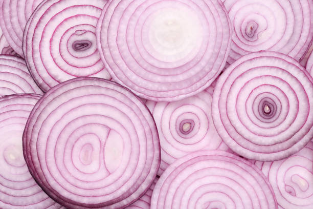 istock Onion slices as a background. Top view. 1166826659