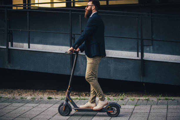 istock Hipster riding an electric scooter 1166826955