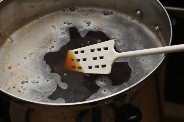 istock Brewing craft beer in a kitchen. Home brewing concept image. 1166830329