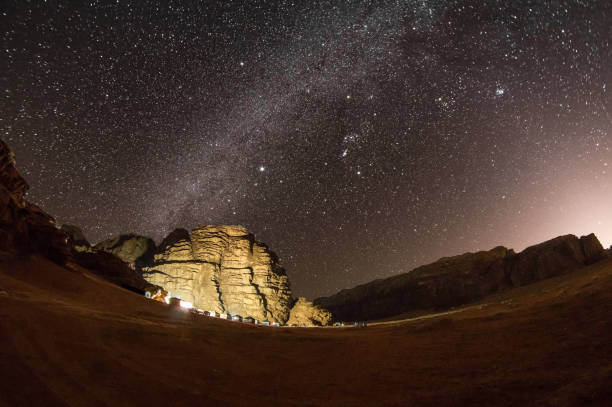Stars over landscape and mountains in Wadi Rum in Jordan Stars over landscape and mountains in Wadi Rum Bedouin camps stock pictures, royalty-free photos & images