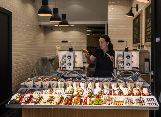 belgian waffle shop with servant, brussels belgium. - brussels waffle belgian waffle people imagens e fotografias de stock