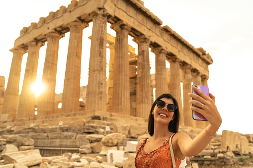 Young Woman Taking A Selfie In Front Of The Parthenon