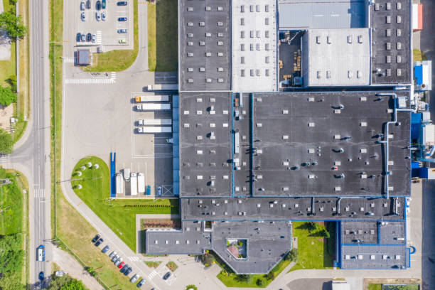 istock Aerial Shot of Industrial Loading Area where Many Trucks Are Unloading Merchandise 1166841978