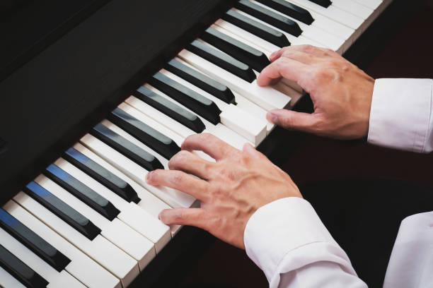 istock Closeup hand man playing piano. Classical music instrument. 1166842474