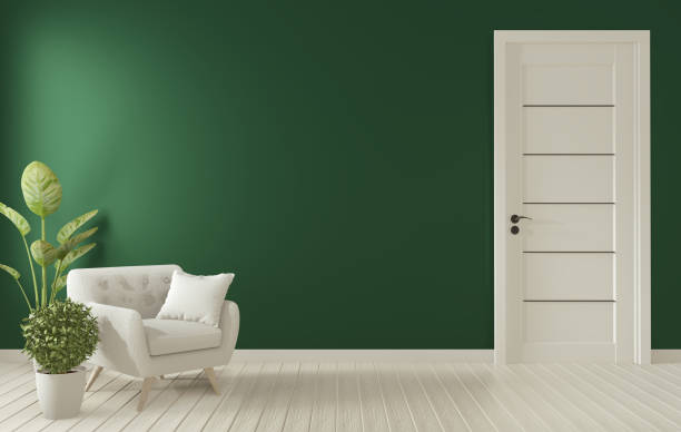 istock Mock up poster frame on dark green living room interior.3D rendering 1166843020