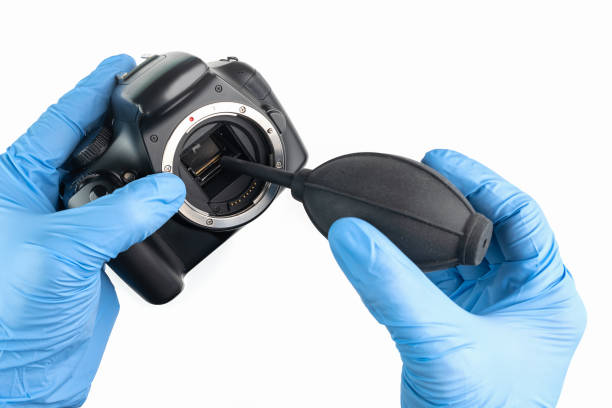 istock a professional cleaning of a camera with a bellow and gloves 1166846813