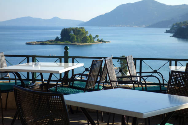 istock Outdoors restaurant tables with sea view 1166846829