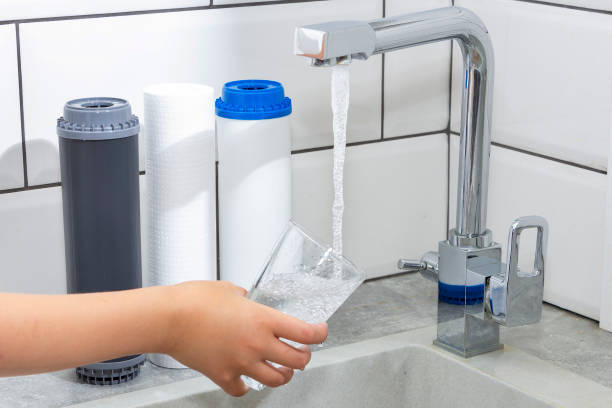 istock The tap from which water flows. Quenching thirst. Water problems in some countries.The glass is filled with water. 1166847953