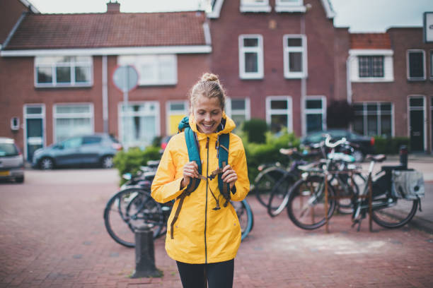 istock Smiling student walking at the street 1166849600