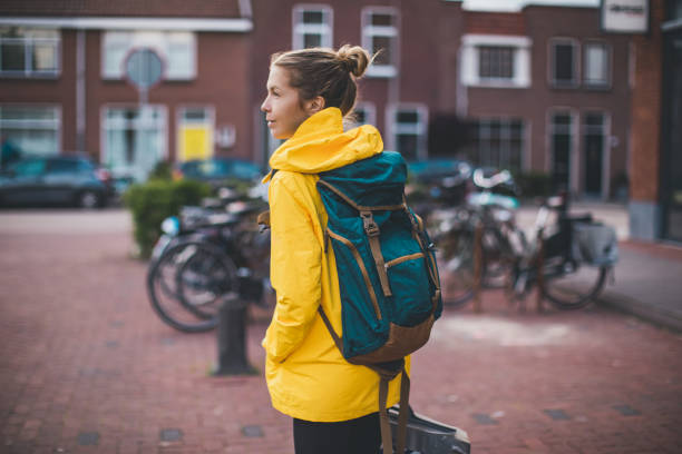 istock Smiling student walking at the street 1166849689