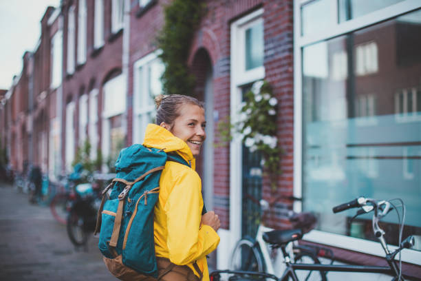 istock Smiling student walking at the street 1166849784