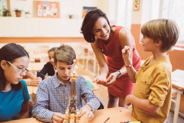 istock School children with teacher in class 1166850577