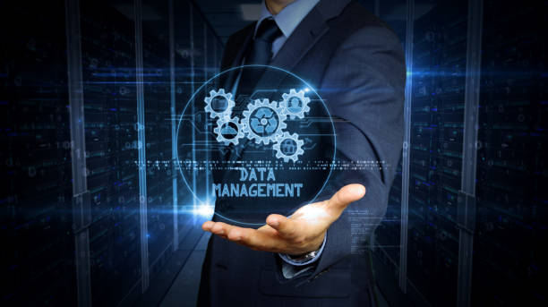 istock Businessman touch screen with data management hologram 1166853583