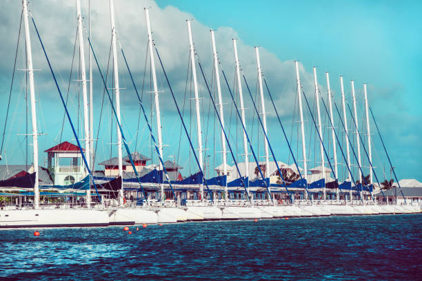 The mast of the yacht against the blue sky.