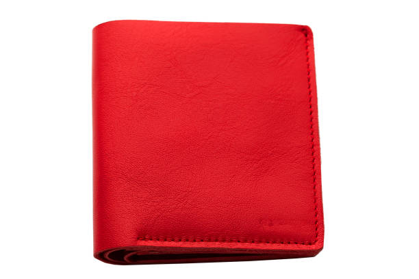 istock Red leather purse on a white background close-up.Compact wallet 1166857039