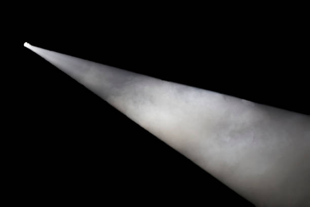 istock White ray of smoke from the spotlight on a black background 1166858025