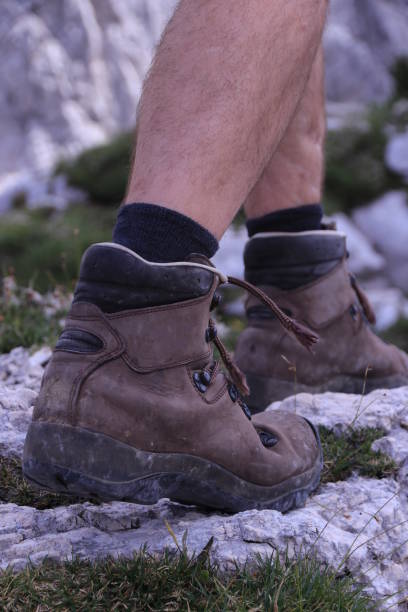 istock Hiking over rocks on a mountain trail 1166859565