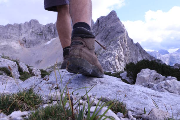 istock Hiking over rocks on a mountain trail 1166859568