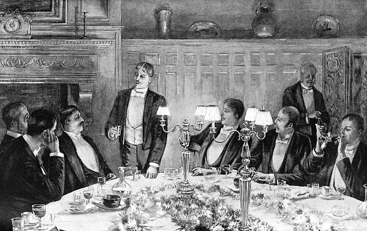 Group of men at a dinner party in New York City, New York, USA. Vintage etching circa late 19th century.